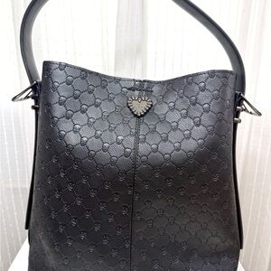 Betsey Johnson black leather Shoulder Bag with her signature skull details.